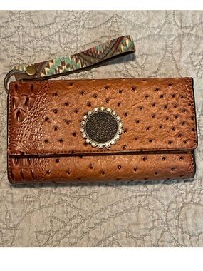 Brown Textured Wristlet Wallet with Decorative Medallion